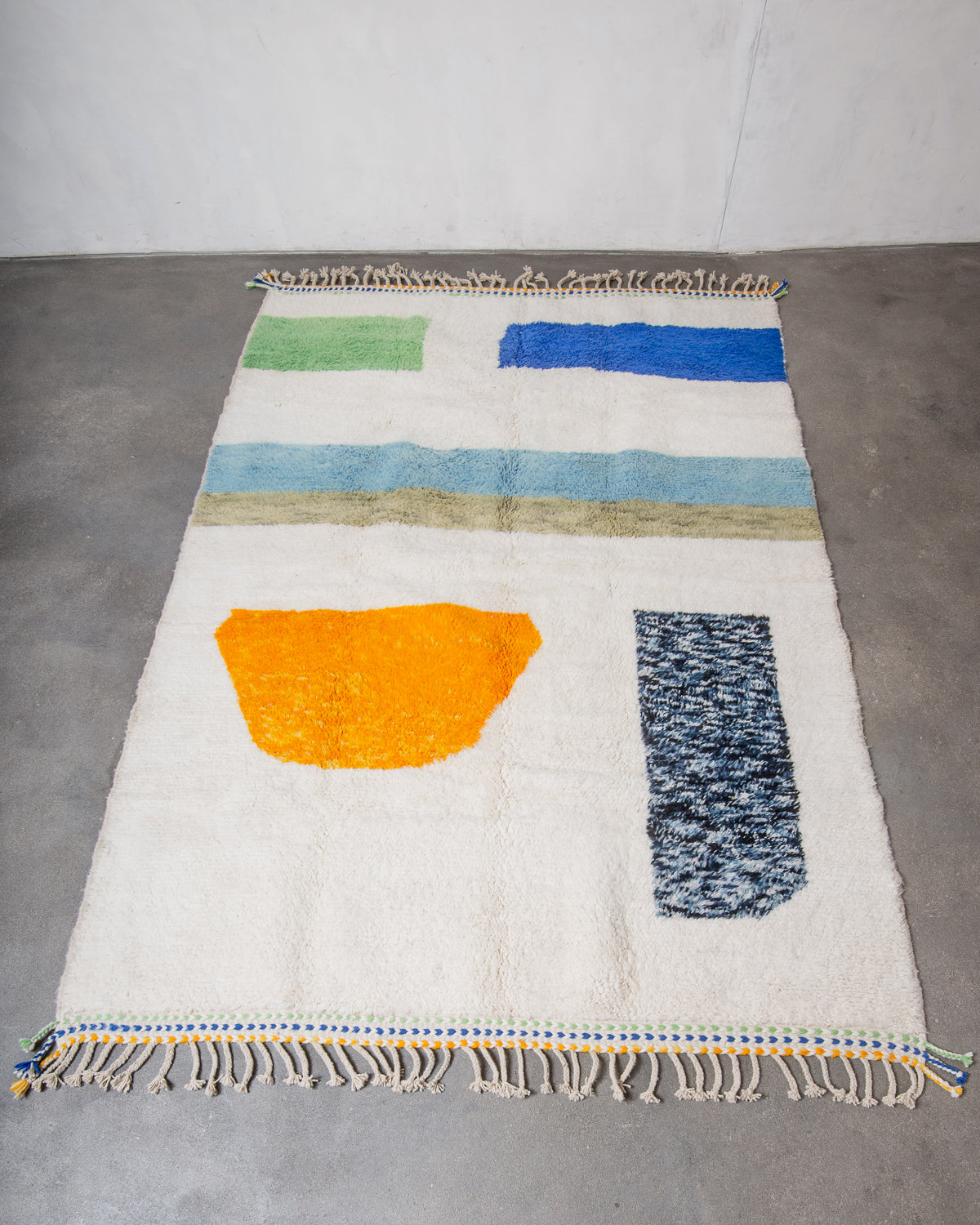 Modern, designer, handcrafted Berber rug from Morocco. Beniourain carpet with beautiful colours and patterns and fluffy wool texture.